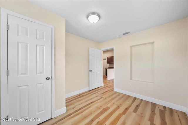 unfurnished bedroom featuring light hardwood / wood-style flooring