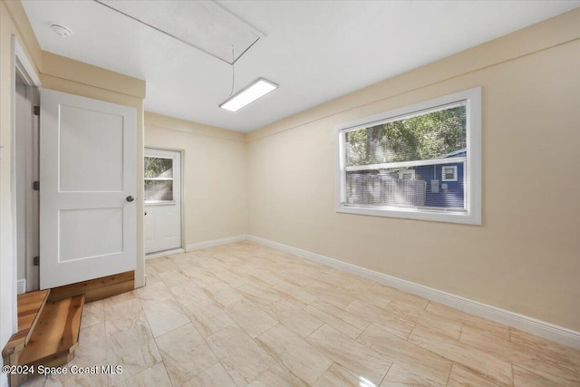 spare room with a wealth of natural light