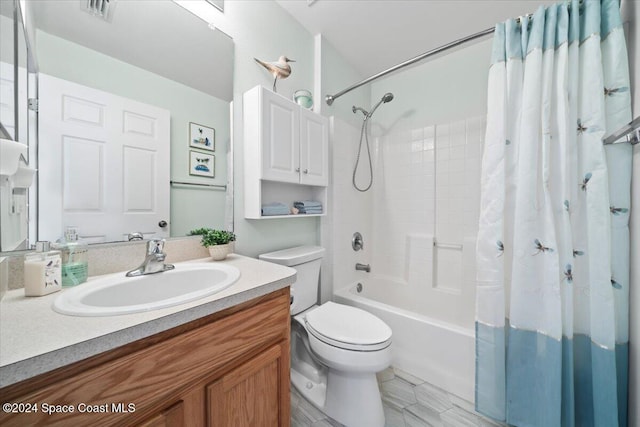 full bathroom featuring shower / bath combo, toilet, and vanity