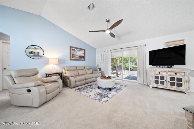 carpeted living room with a textured ceiling, ceiling fan, and lofted ceiling