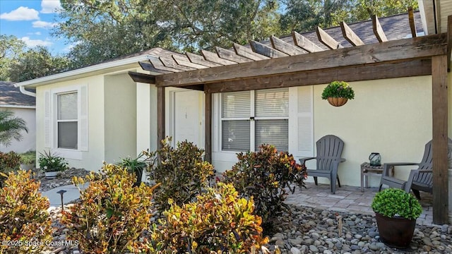 exterior space with a pergola and a patio