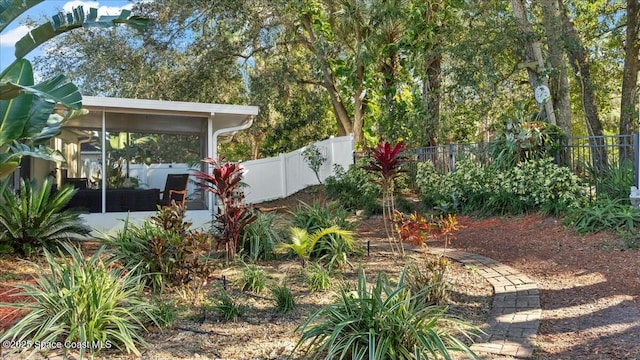 view of yard with a sunroom