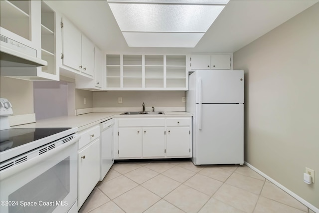 kitchen with white appliances, extractor fan, sink, light tile patterned floors, and white cabinetry