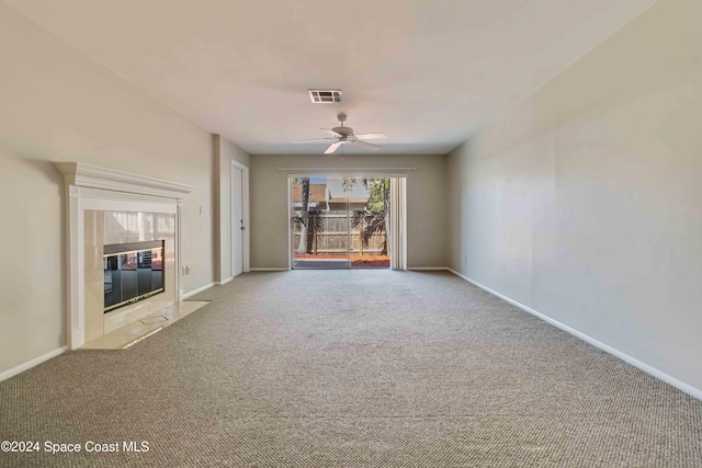 unfurnished living room with light carpet and ceiling fan