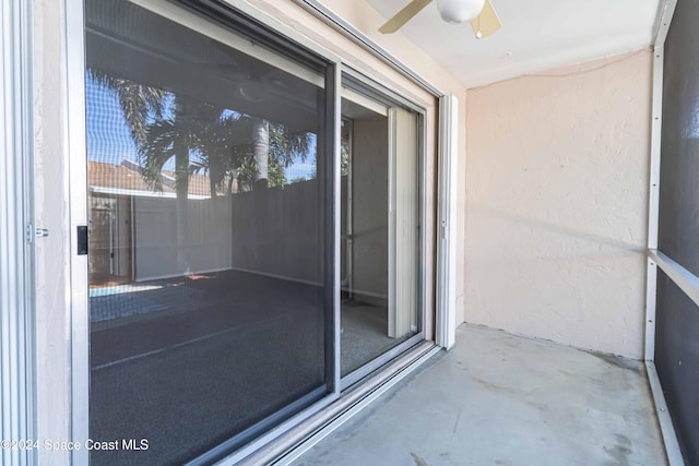 balcony featuring ceiling fan and a patio area