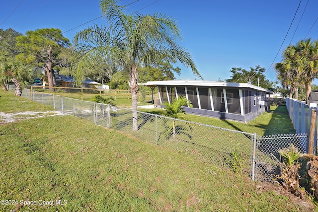 view of yard featuring a sunroom