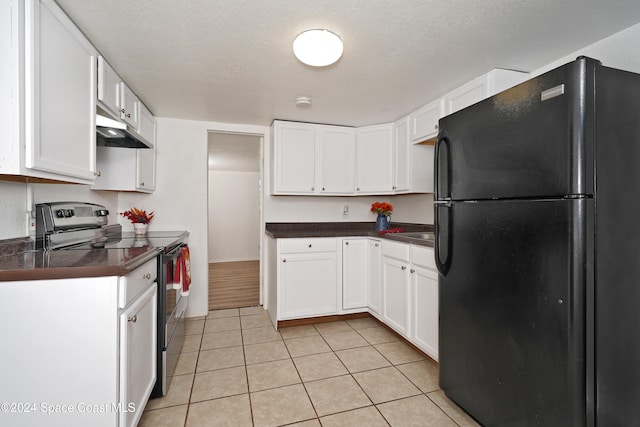 kitchen featuring white cabinets, a textured ceiling, black fridge, and stainless steel electric stove