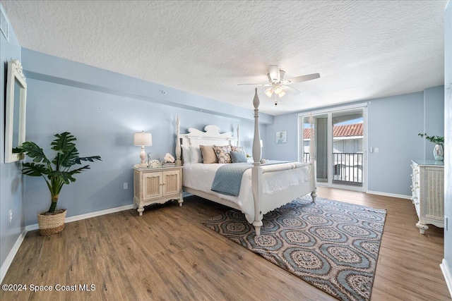 bedroom with hardwood / wood-style flooring, ceiling fan, a textured ceiling, and access to outside