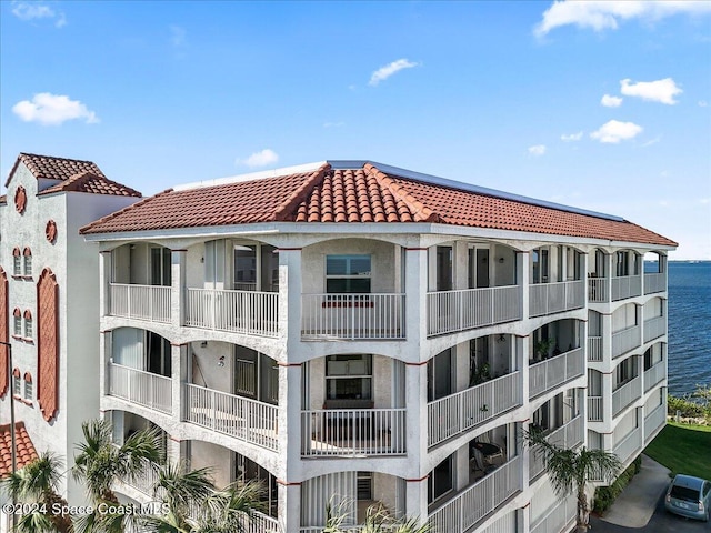 view of building exterior featuring a water view