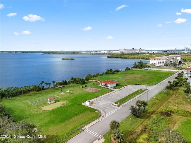 birds eye view of property with a water view