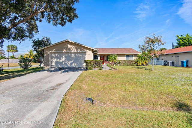 ranch-style home featuring central AC unit, a garage, and a front yard