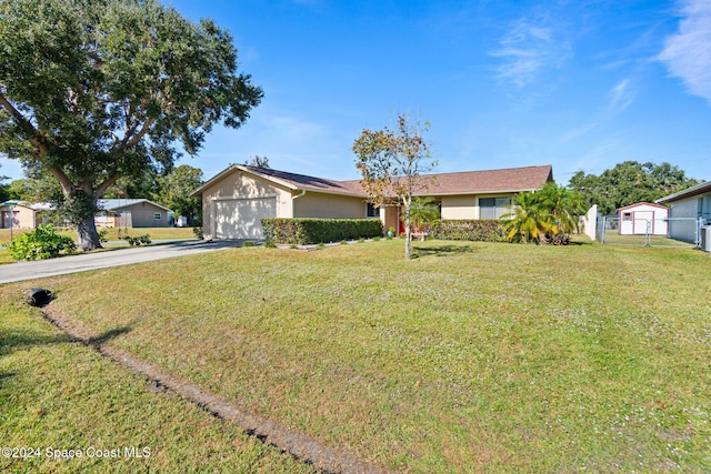 ranch-style home with a garage and a front lawn