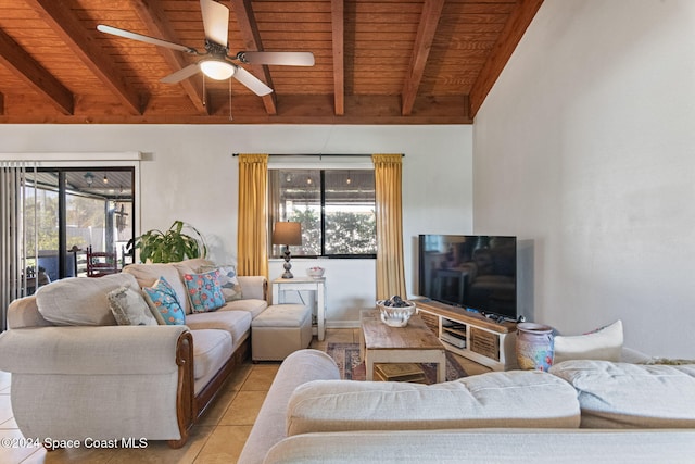 living room with beam ceiling, ceiling fan, light tile patterned floors, and wood ceiling