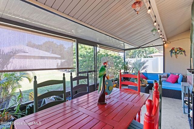 sunroom / solarium with lofted ceiling