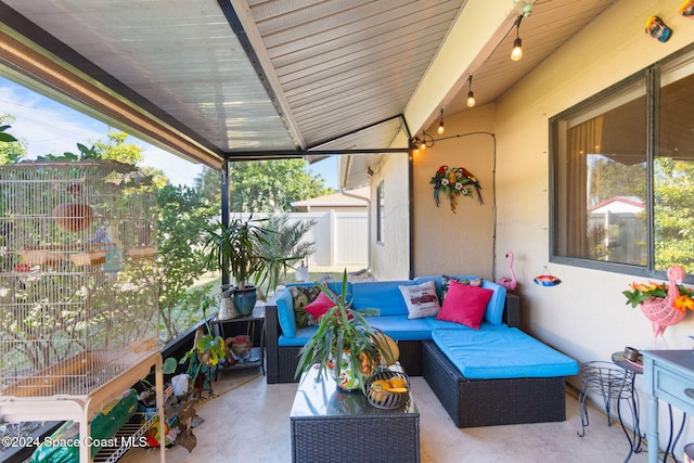 sunroom / solarium with vaulted ceiling