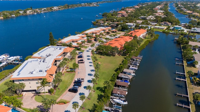 birds eye view of property featuring a water view and a residential view