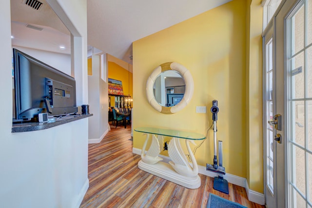 hallway with wood-type flooring