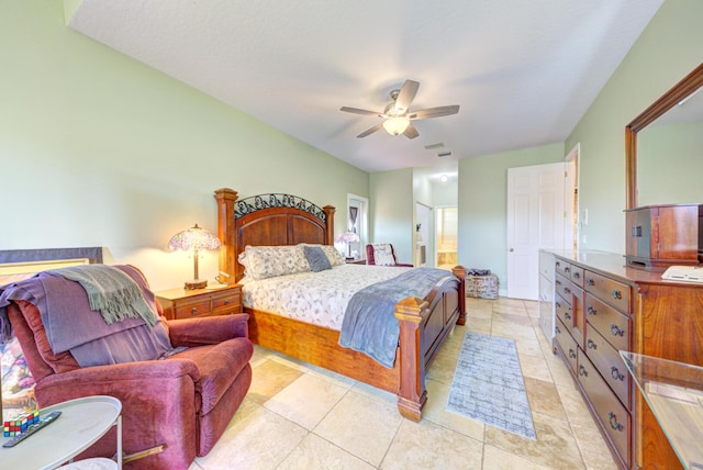 bedroom featuring connected bathroom and a ceiling fan