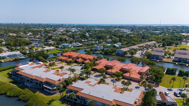 aerial perspective of suburban area with a large body of water