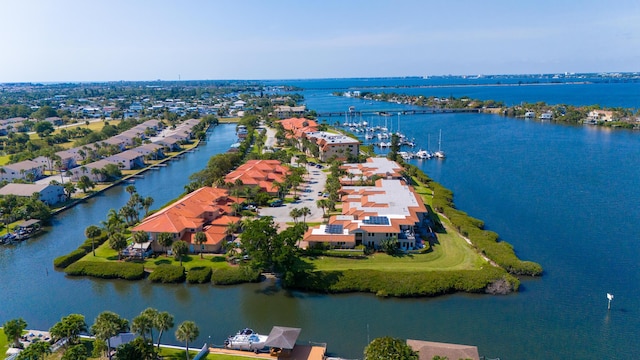 aerial view of residential area with a large body of water