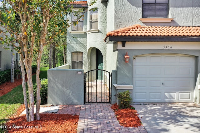 view of front of property with a garage