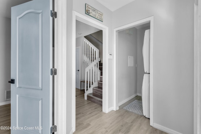 3156 Via Palma Ln, Kissimmee, FL 34744 - hallway with light wood finished floors, baseboards, and stairs