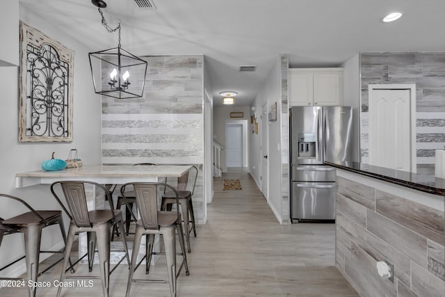 3156 Via Palma Ln, Kissimmee, FL 34744 - dining room with a chandelier, light wood-style flooring, and recessed lighting