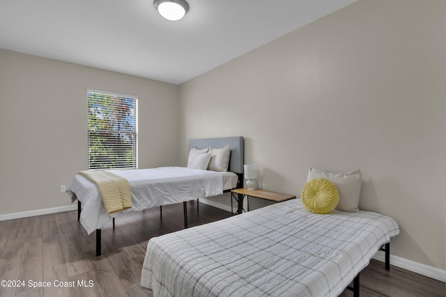 bedroom with hardwood / wood-style flooring