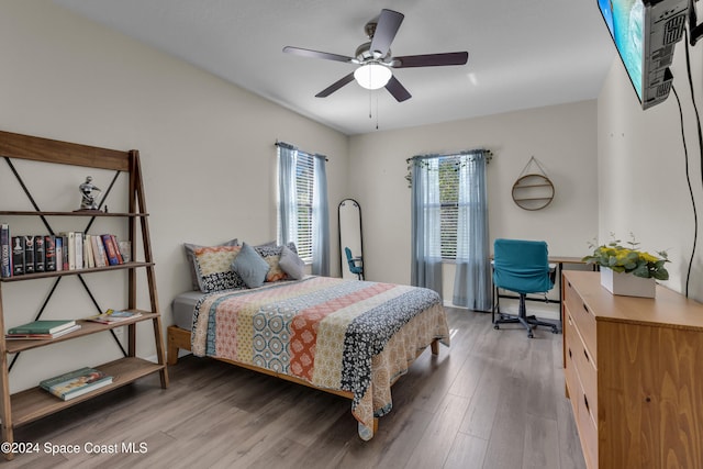 bedroom featuring hardwood / wood-style floors and ceiling fan