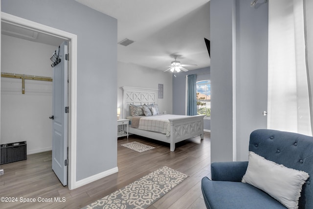 bedroom featuring light hardwood / wood-style flooring and ceiling fan