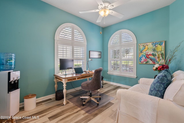 office area with ceiling fan and light hardwood / wood-style flooring