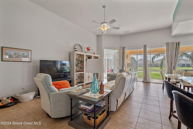 tiled living room featuring ceiling fan