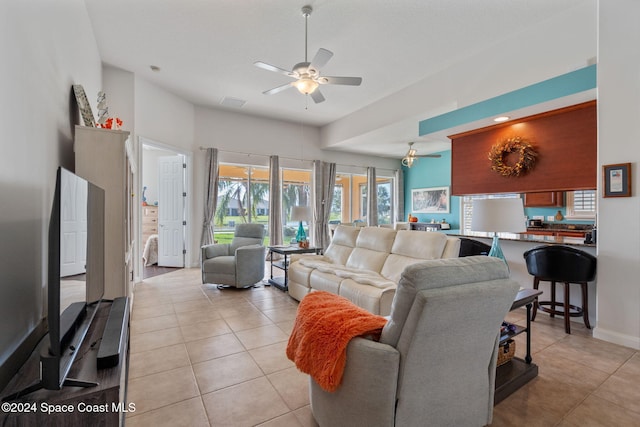 tiled living room with ceiling fan