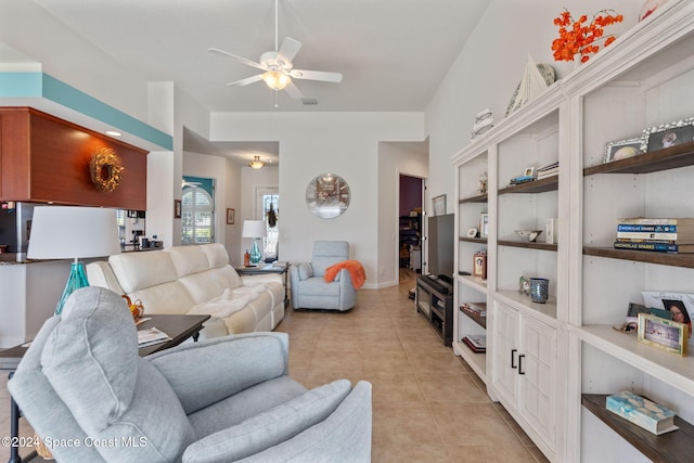 tiled living room with ceiling fan