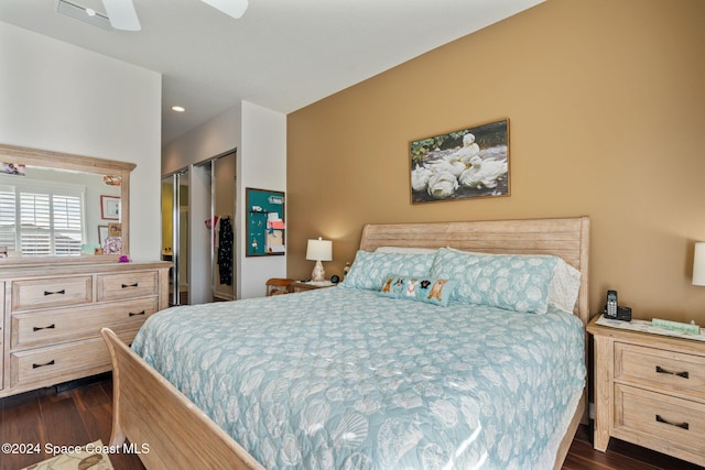 bedroom featuring a closet, ceiling fan, and dark wood-type flooring