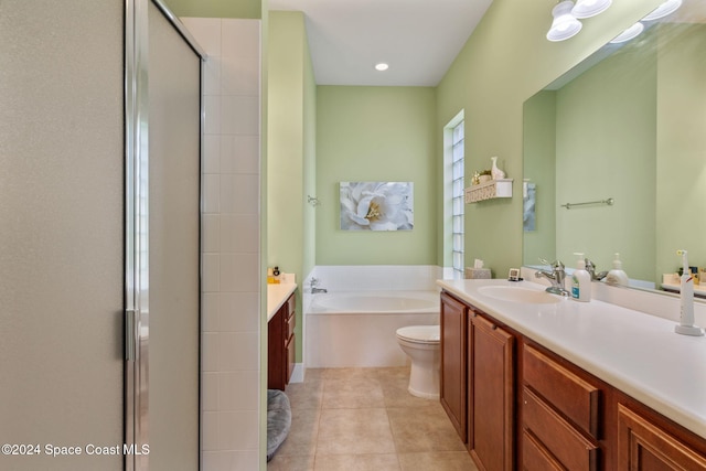 full bathroom with tile patterned flooring, vanity, toilet, and independent shower and bath