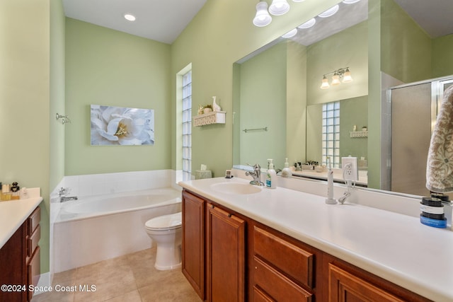 full bathroom featuring tile patterned flooring, vanity, separate shower and tub, and toilet