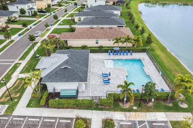 birds eye view of property featuring a water view