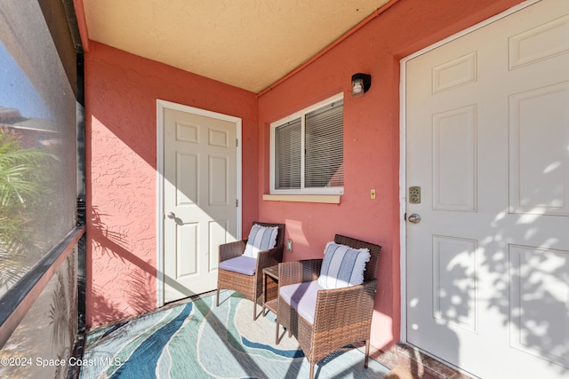 13433 Heald Ln Unit 1, Fort Myers, FL 33908 - property entrance with stucco siding