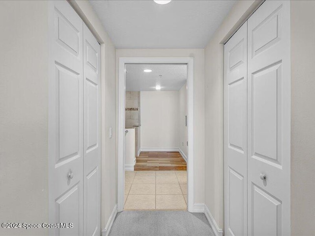 hallway with light tile patterned flooring