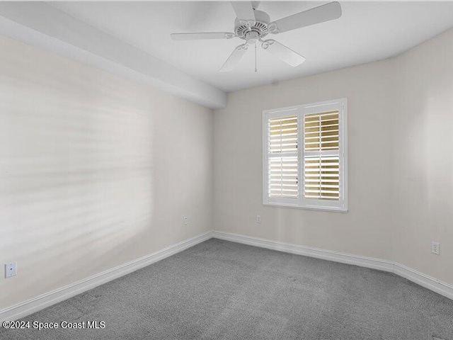 spare room with carpet flooring and ceiling fan