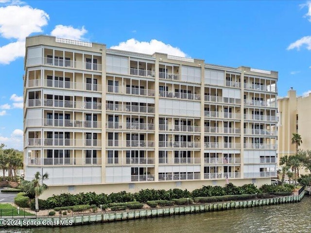 view of building exterior with a water view