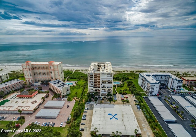 bird's eye view featuring a water view and a view of the beach