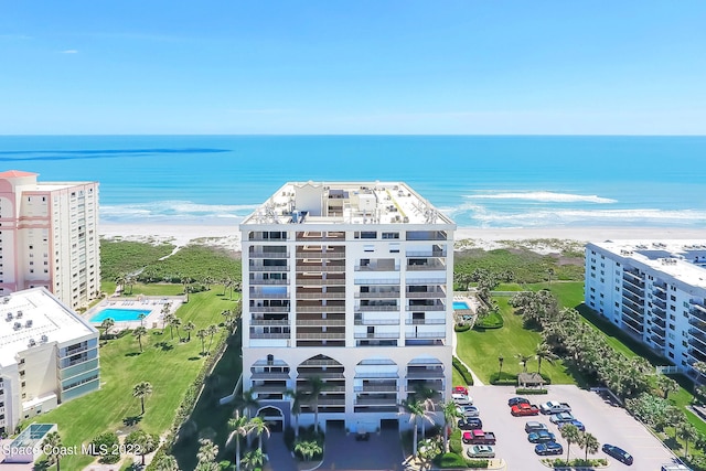 aerial view featuring a water view and a beach view