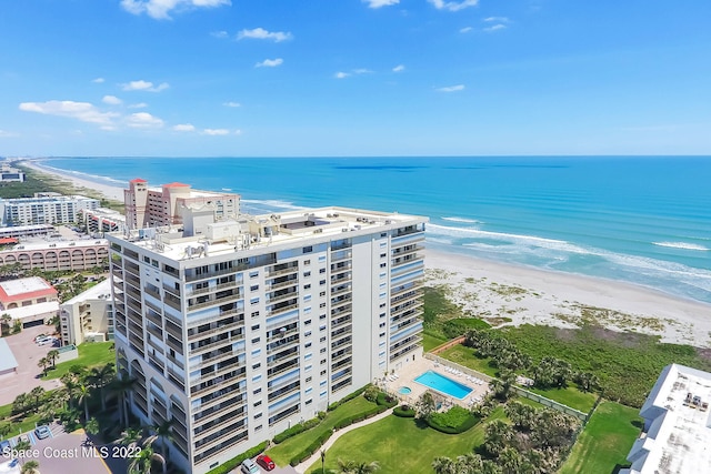 aerial view with a water view and a view of the beach