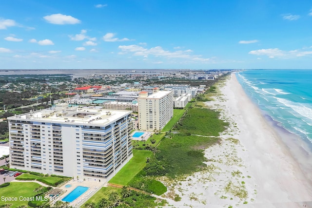 bird's eye view featuring a water view and a view of the beach