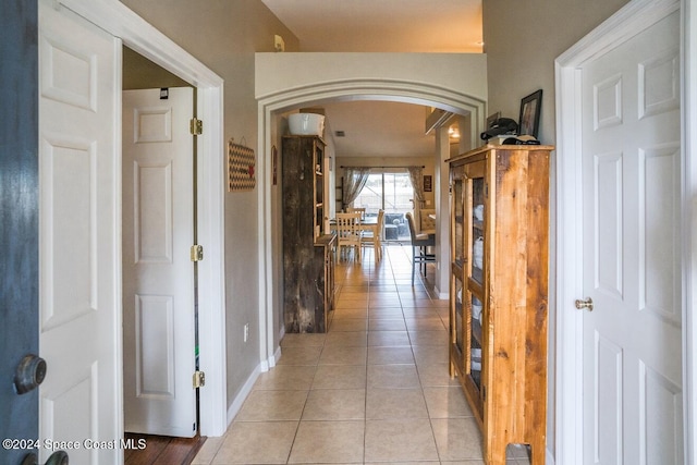 corridor with light tile patterned flooring