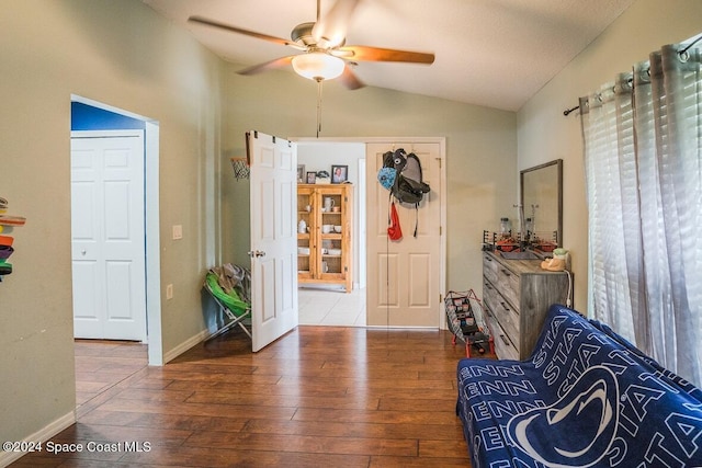 entrance foyer featuring hardwood / wood-style flooring, vaulted ceiling, and ceiling fan