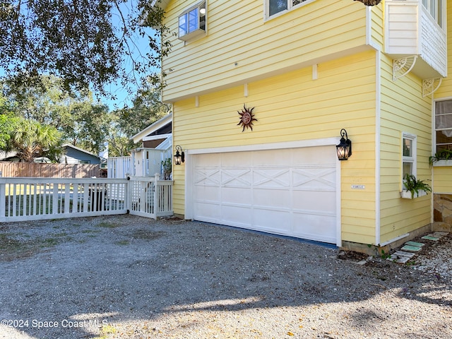 view of property exterior with a garage