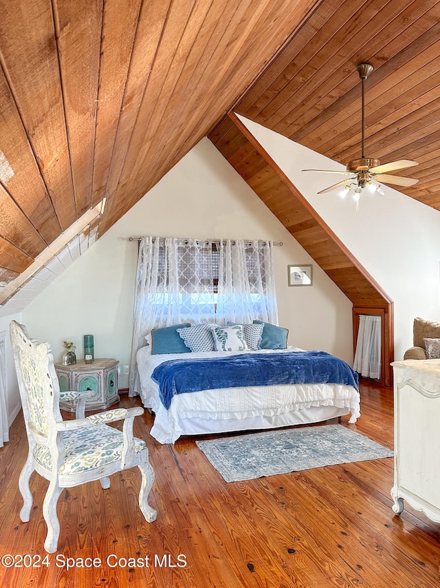 bedroom with hardwood / wood-style flooring, ceiling fan, lofted ceiling, and wood ceiling